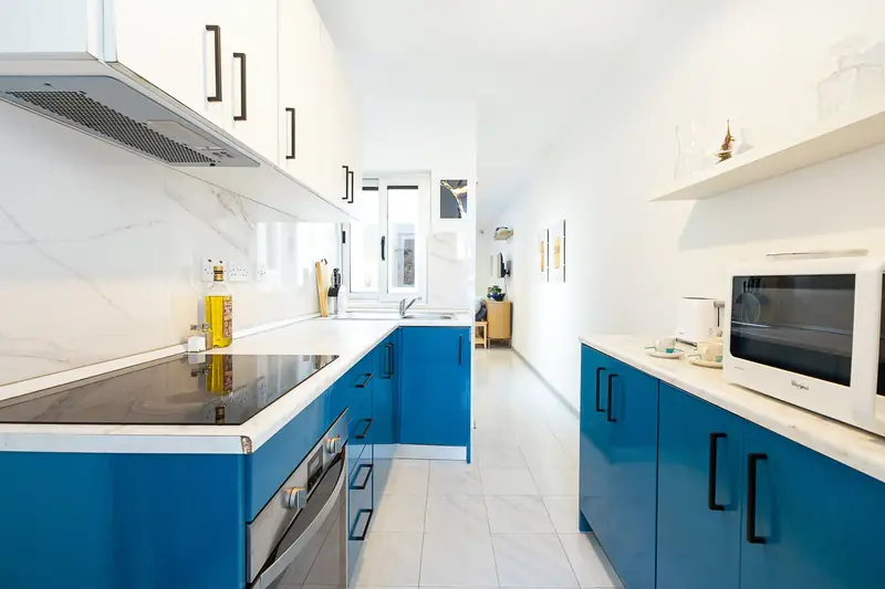 Kitchen with blue cabinets