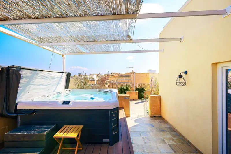 Terrace with a hot tub